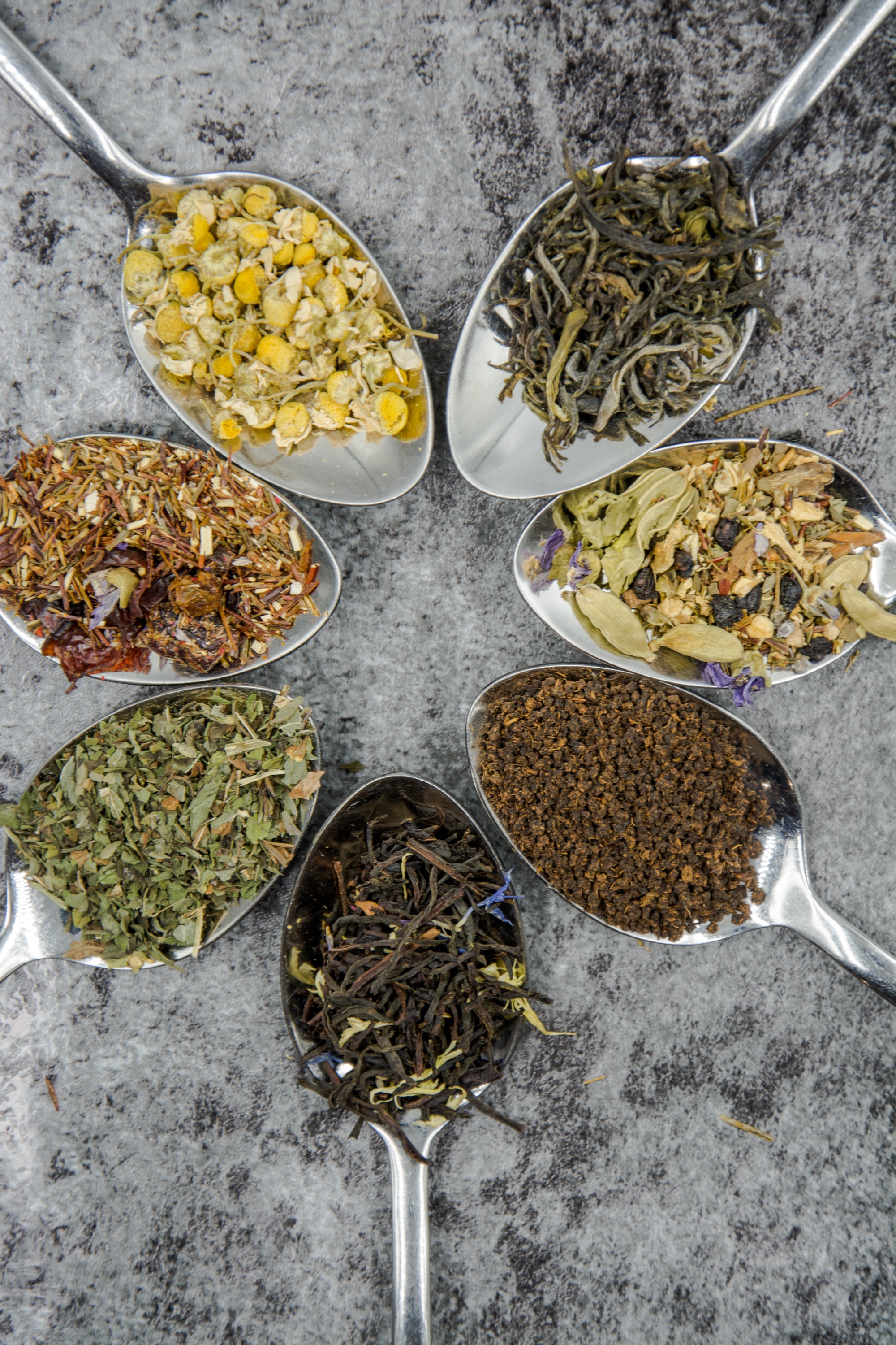 Best Bulk Herbs And Spices For Herbal Tea shown on spoons