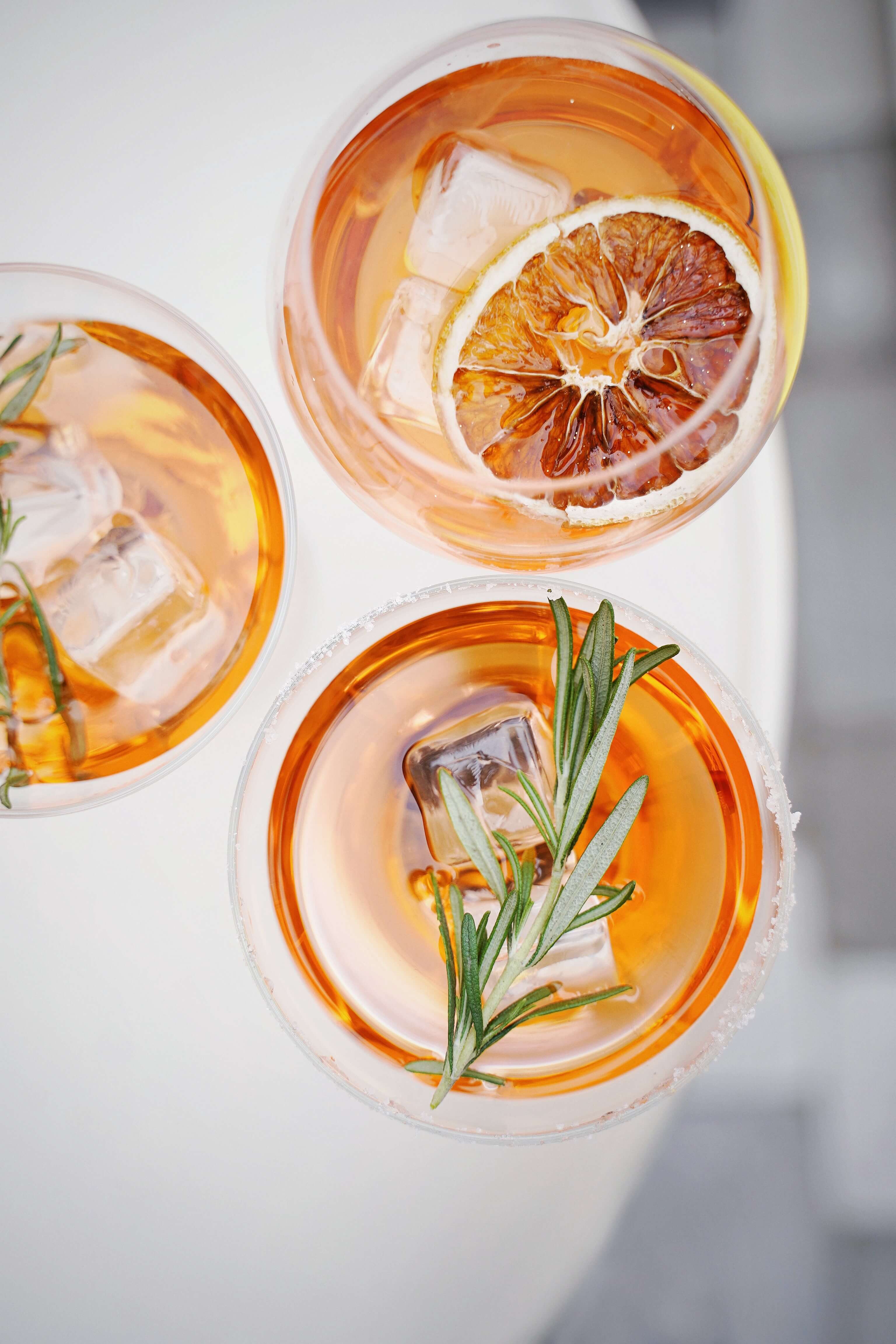 An image of cocktails show how to infuse liquor with Herbs and Spices.