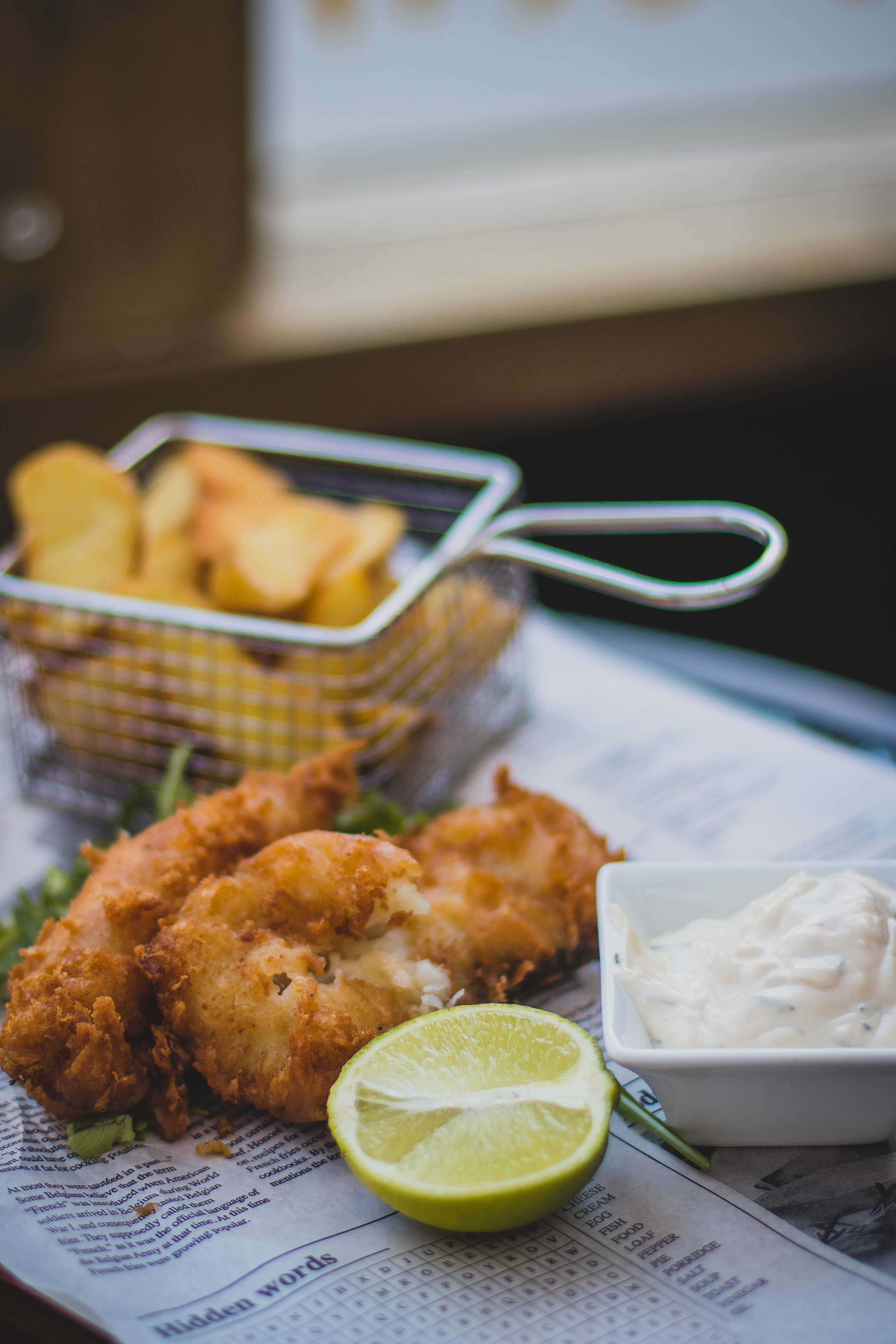 An image of traditional fish and chips using different herbs and spices.